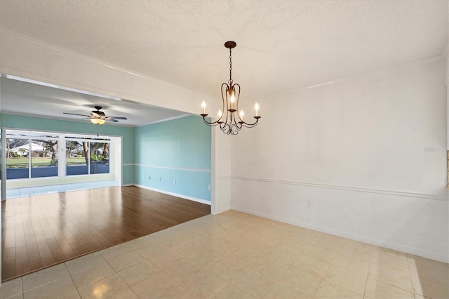 empty room with light tile patterned floors, baseboards, ornamental molding, a textured ceiling, and ceiling fan with notable chandelier