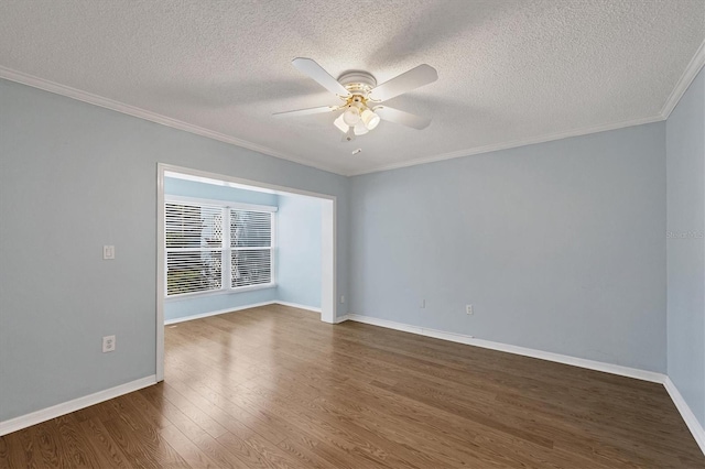 unfurnished room with baseboards, ceiling fan, ornamental molding, and dark wood-type flooring