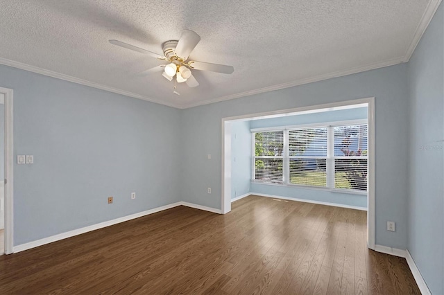 unfurnished room featuring a textured ceiling, a ceiling fan, baseboards, dark wood finished floors, and crown molding