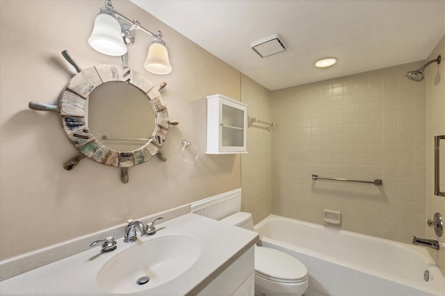 full bath with shower / bathing tub combination, vanity, and toilet