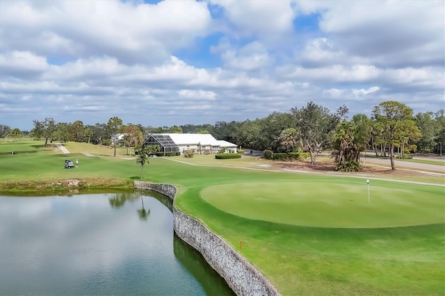 surrounding community with a water view and view of golf course