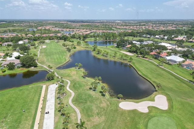 aerial view with view of golf course and a water view