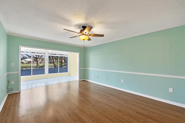 454 Cerromar Rd Unit 174, Venice, FL 34293 - spare room with ceiling fan, wood finished floors, a textured ceiling, baseboards, and crown molding
