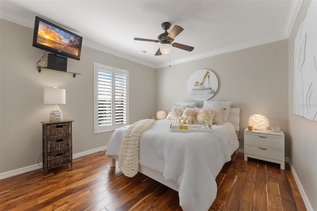 bedroom featuring dark wood-type flooring, crown molding, baseboards, and ceiling fan