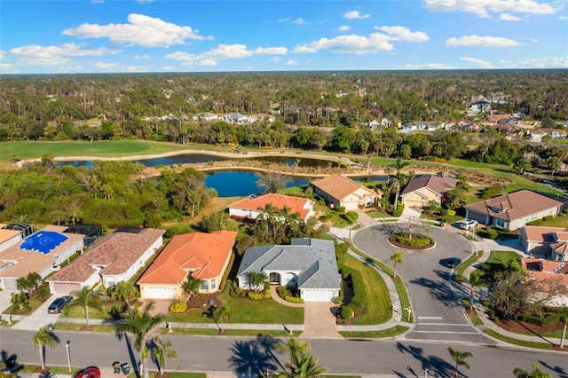 birds eye view of property with a residential view and a water view