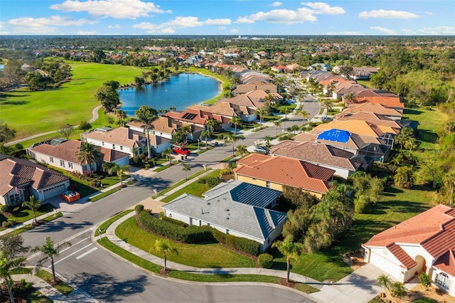 birds eye view of property with a residential view, a water view, and golf course view