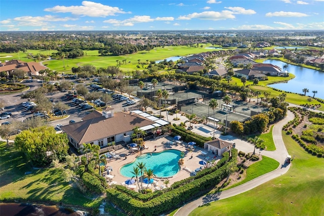 drone / aerial view with a water view and a residential view