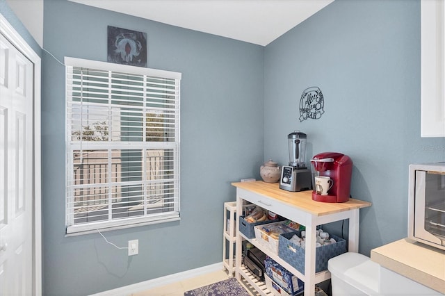 miscellaneous room with baseboards