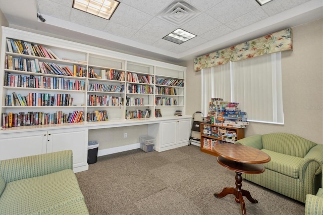 living area featuring carpet and visible vents