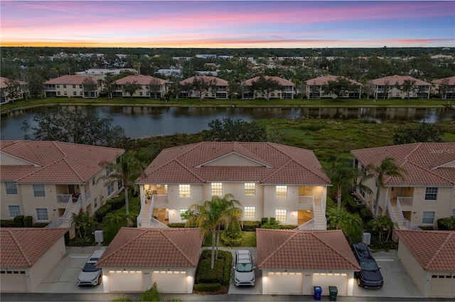 aerial view with a water view and a residential view