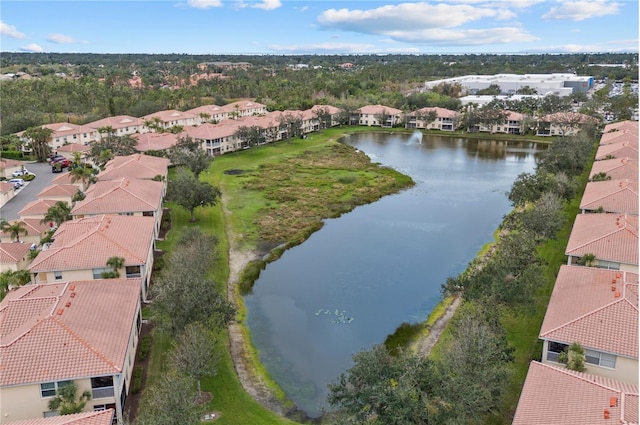 bird's eye view with a residential view and a water view