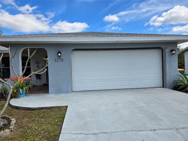 garage featuring driveway