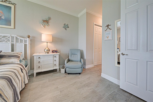 bedroom with ornamental molding and baseboards