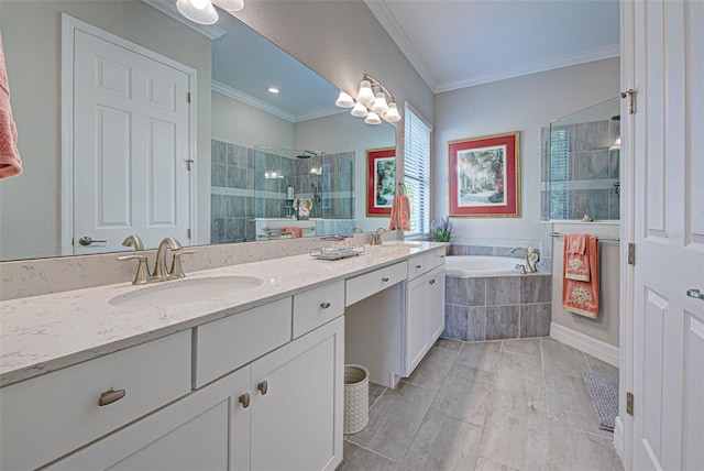 full bathroom featuring ornamental molding, a sink, a shower stall, and double vanity