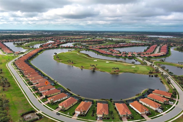 bird's eye view featuring a water view and a residential view