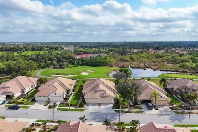 aerial view with a water view, view of golf course, and a residential view