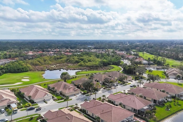 aerial view with golf course view, a water view, and a residential view