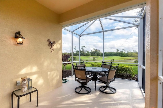 sunroom / solarium featuring golf course view