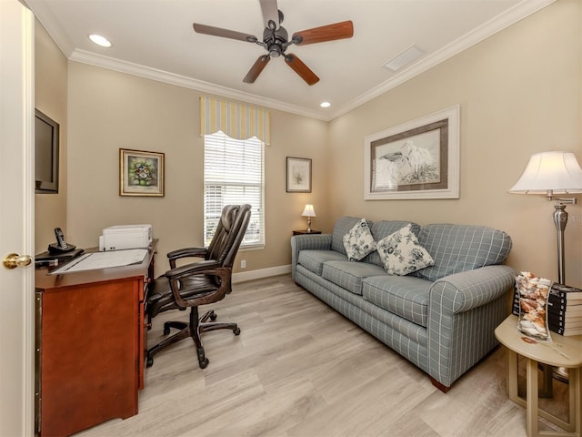 office area featuring visible vents, baseboards, light wood-style flooring, ceiling fan, and crown molding