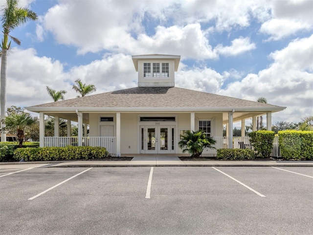 view of property featuring uncovered parking