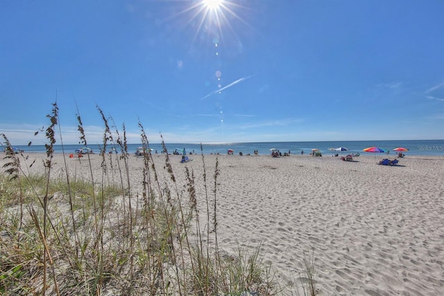 property view of water featuring a beach view