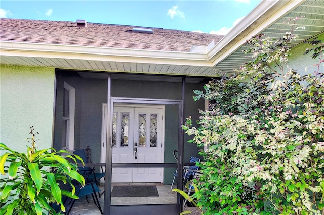 23495 Altman Ave, Punta Gorda, FL 33980 - property entrance featuring a shingled roof and stucco siding
