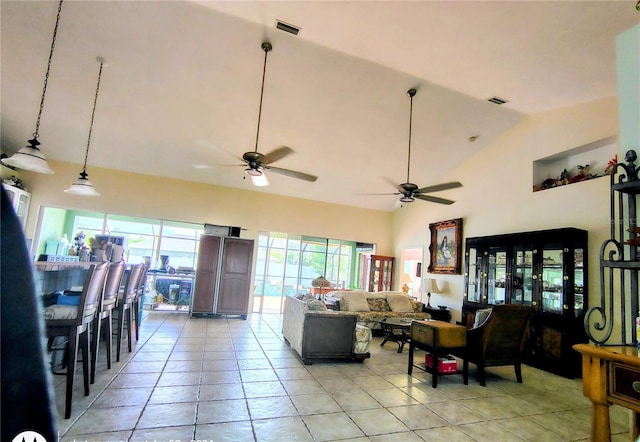 23495 Altman Ave, Punta Gorda, FL 33980 - living room featuring a ceiling fan, light tile patterned floors, high vaulted ceiling, and visible vents
