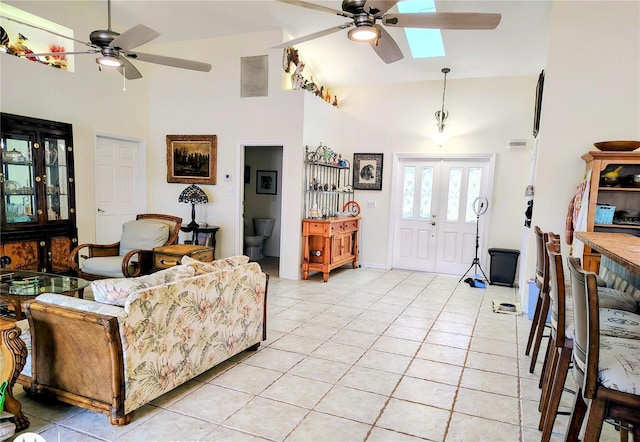 23495 Altman Ave, Punta Gorda, FL 33980 - living area featuring a ceiling fan, light tile patterned floors, high vaulted ceiling, and visible vents