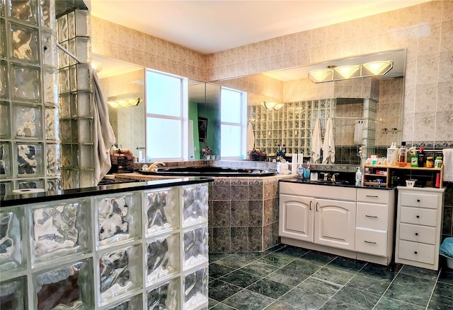 23495 Altman Ave, Punta Gorda, FL 33980 - full bath with tiled shower, vanity, and tile walls