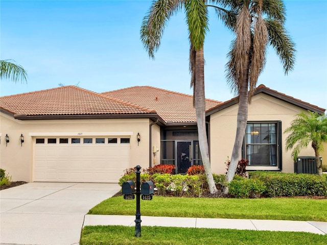 view of front of house with cooling unit, a garage, a tile roof, concrete driveway, and stucco siding