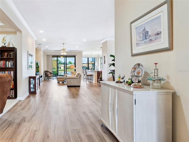 hall with baseboards, recessed lighting, light wood-type flooring, and crown molding