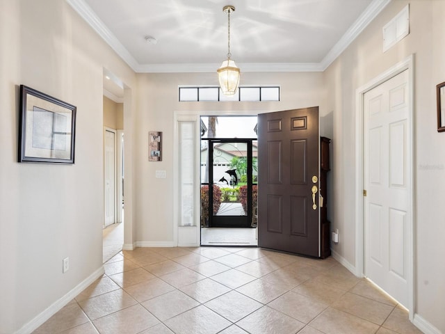 foyer entrance featuring light tile patterned floors, visible vents, baseboards, and crown molding