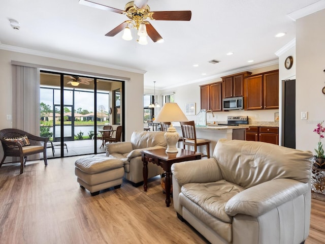 1425 Maseno Dr, Venice, FL 34292 - living room featuring light wood finished floors, crown molding, ceiling fan, and recessed lighting