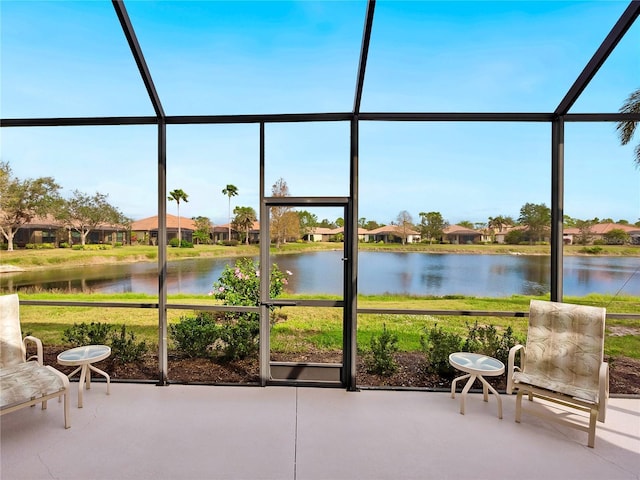 1425 Maseno Dr, Venice, FL 34292 - sunroom featuring a water view and a residential view