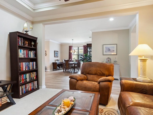 1425 Maseno Dr, Venice, FL 34292 - living area with ornamental molding, baseboards, and light wood finished floors