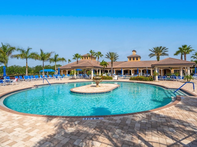1425 Maseno Dr, Venice, FL 34292 - community pool with a patio area, ceiling fan, and a gazebo