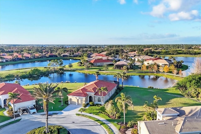 aerial view featuring a residential view and a water view