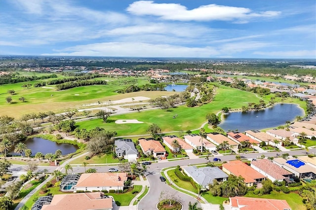 aerial view with a water view and golf course view