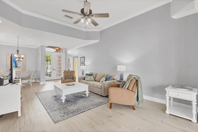 living area featuring ornamental molding, light wood-type flooring, and french doors