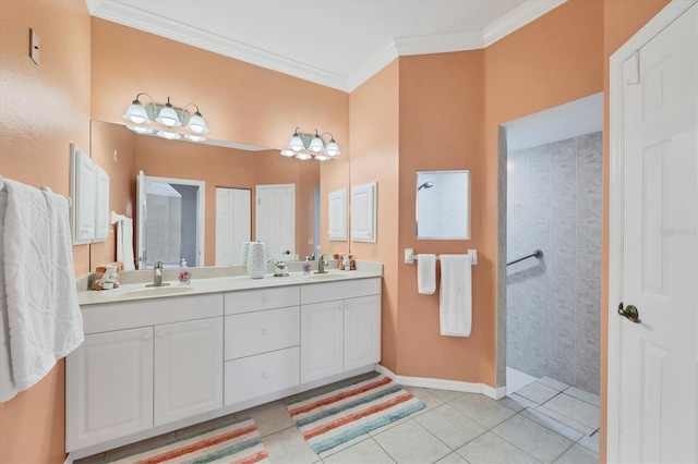 bathroom with ornamental molding, tile patterned flooring, and a sink