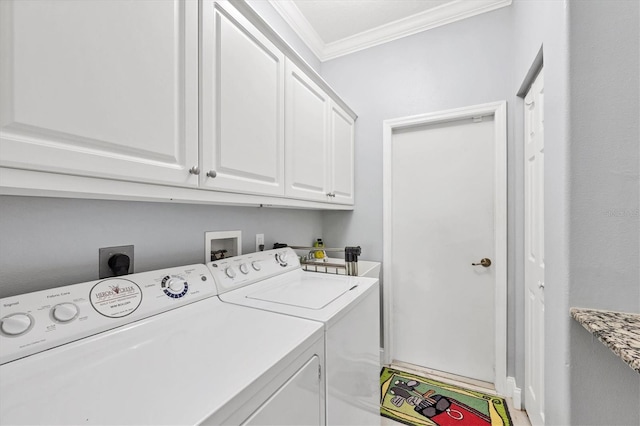 laundry area with independent washer and dryer, cabinet space, and crown molding