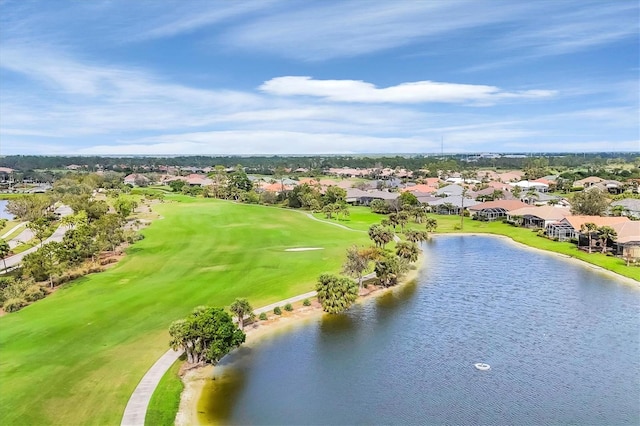 bird's eye view featuring a water view, view of golf course, and a residential view