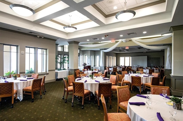 dining space with carpet floors, crown molding, visible vents, coffered ceiling, and ornate columns