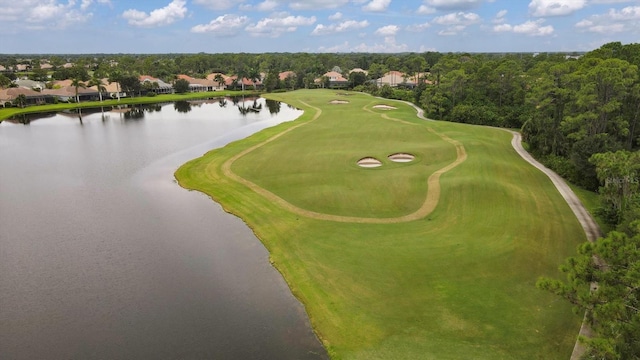 bird's eye view with a water view and golf course view