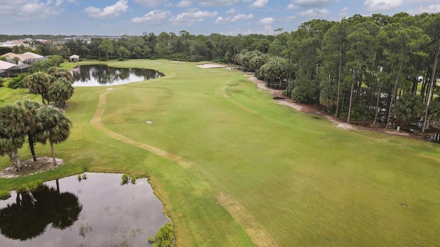 bird's eye view featuring golf course view and a water view