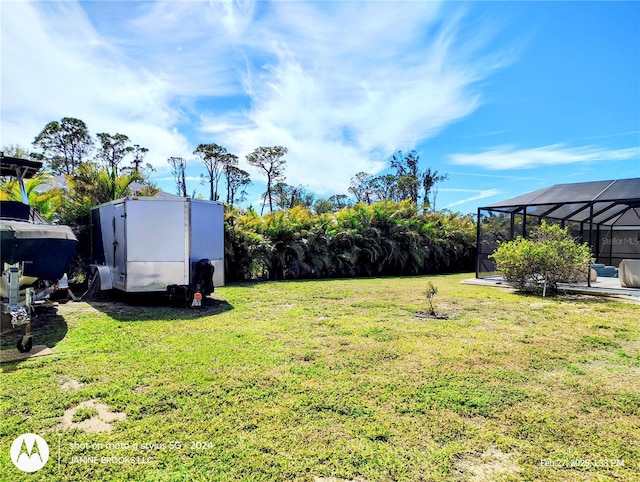 view of yard with a lanai