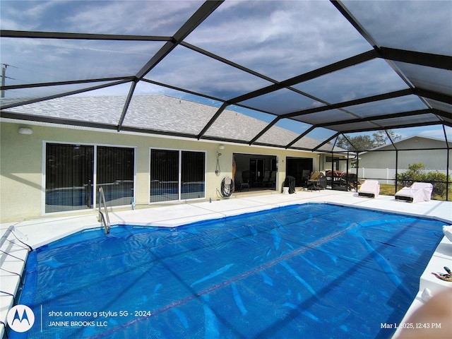 view of pool featuring a patio area, a lanai, and a covered pool