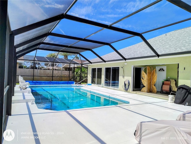 view of pool with a patio, a lanai, and a fenced in pool