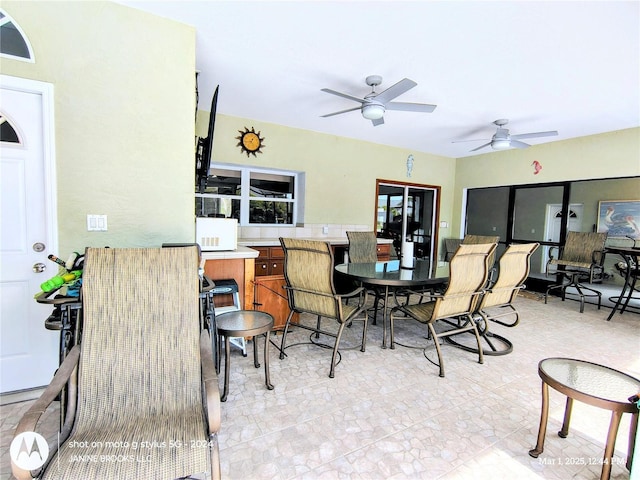 dining room featuring ceiling fan