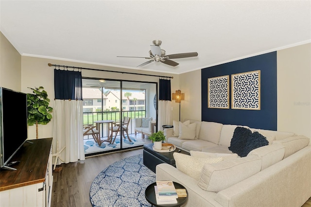 living area featuring crown molding, ceiling fan, and wood finished floors